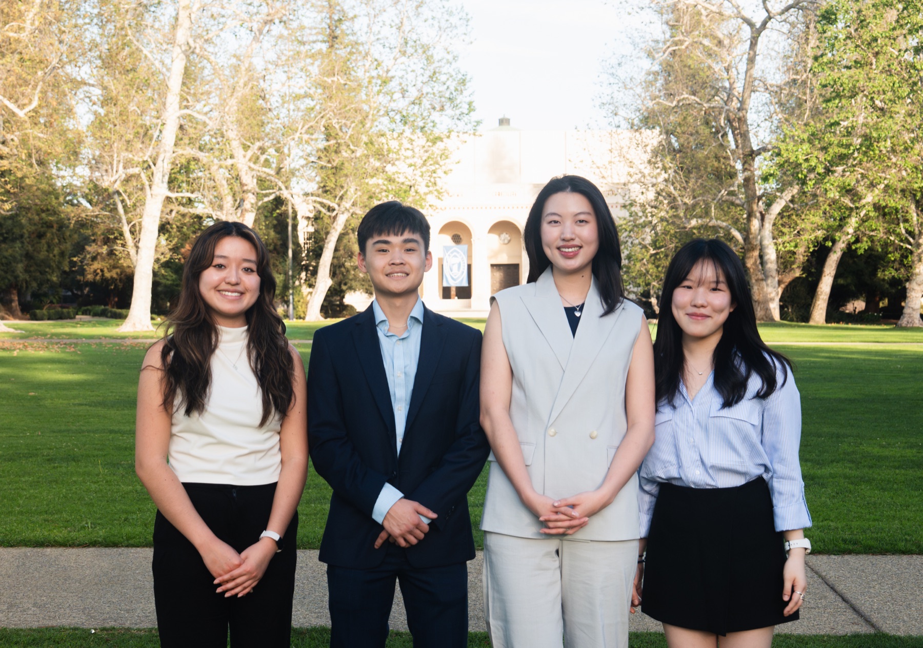 PCG consultants standing together on campus